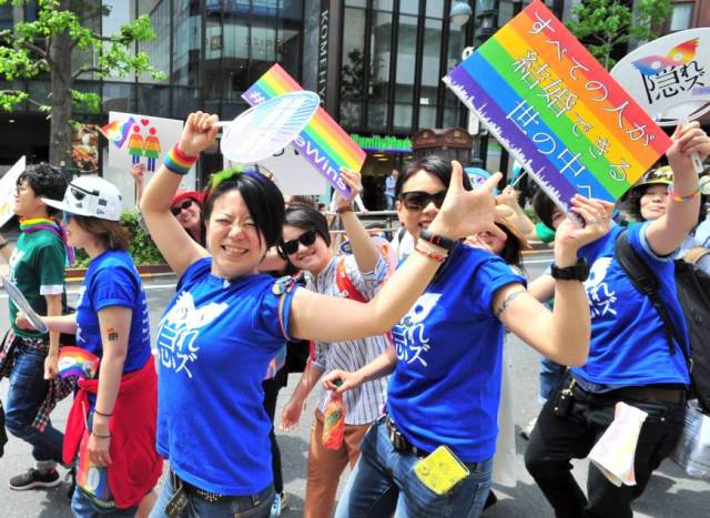 People march through Tokyo’s Shibuya district on Sunday during the Tokyo Rainbow Pride parade. This year’s theme was 'Change,' a call to respect everyone as individuals, regardless of sexuality. | YOSHIAKI MIURA